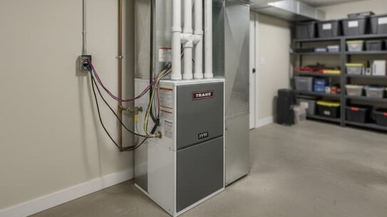 High-efficiency gas furnace installed in a home utility room